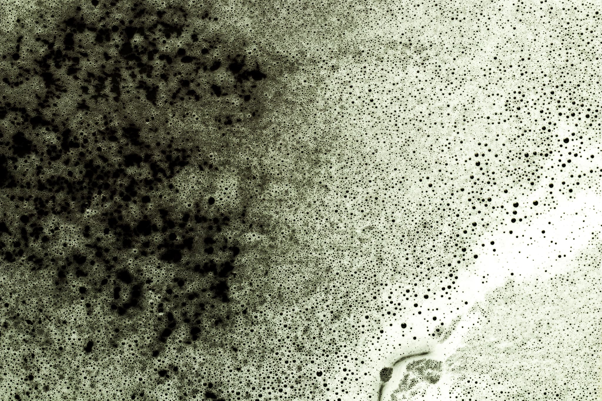 black-liquid-showing-through-foam.jpg