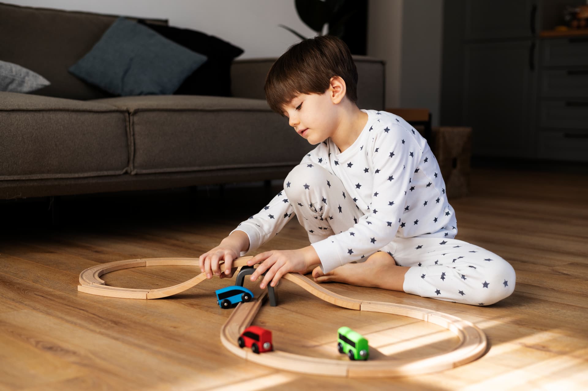 full-shot-kid-playing-with-wooden-cars.jpg