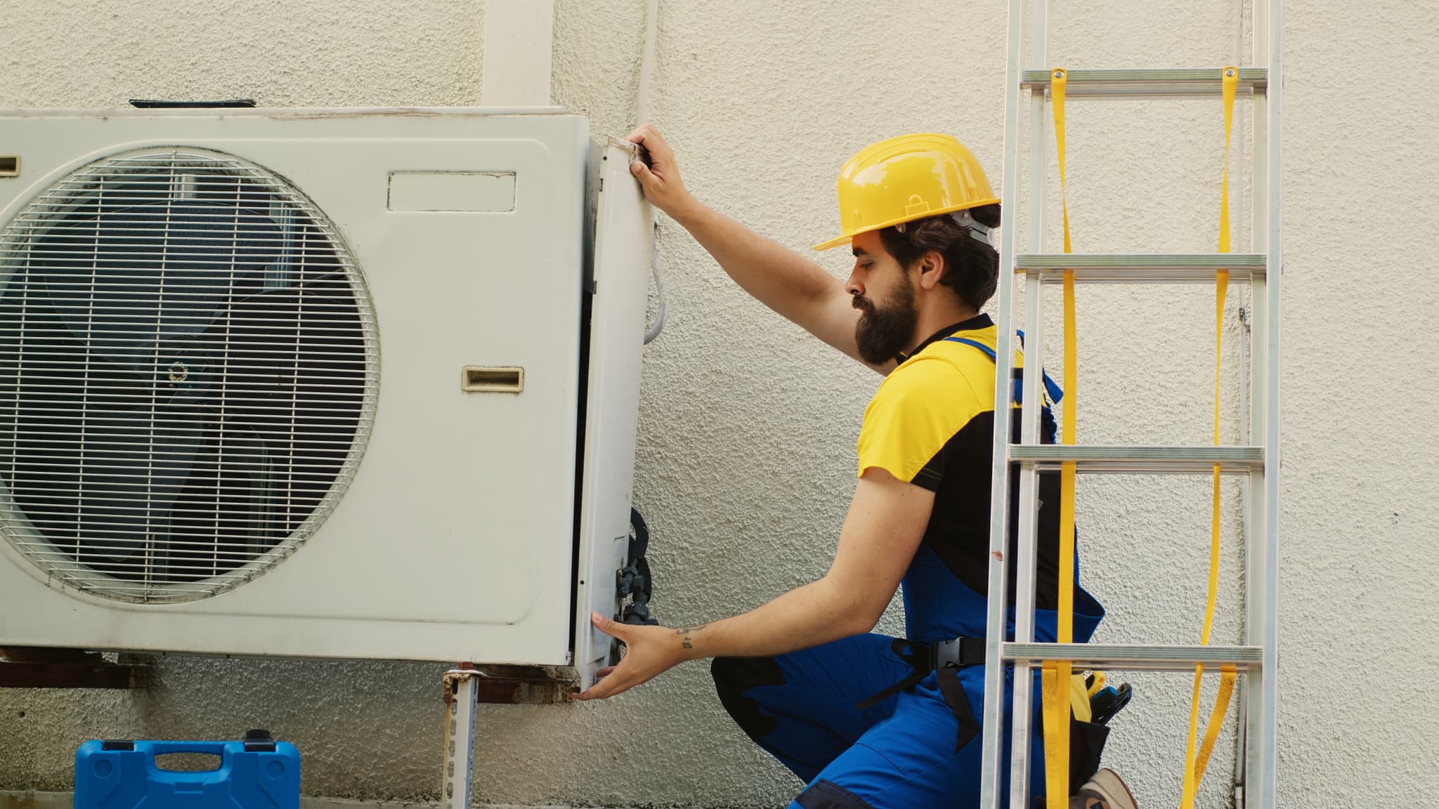 wireman-dissasembling-air-conditioner.jpg