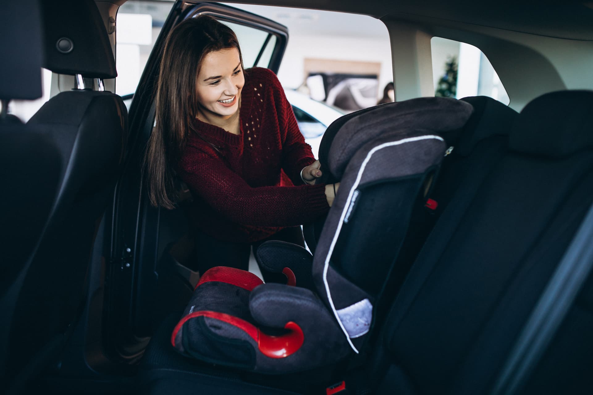 woman-installing-safety-car-sit-into-car.jpg